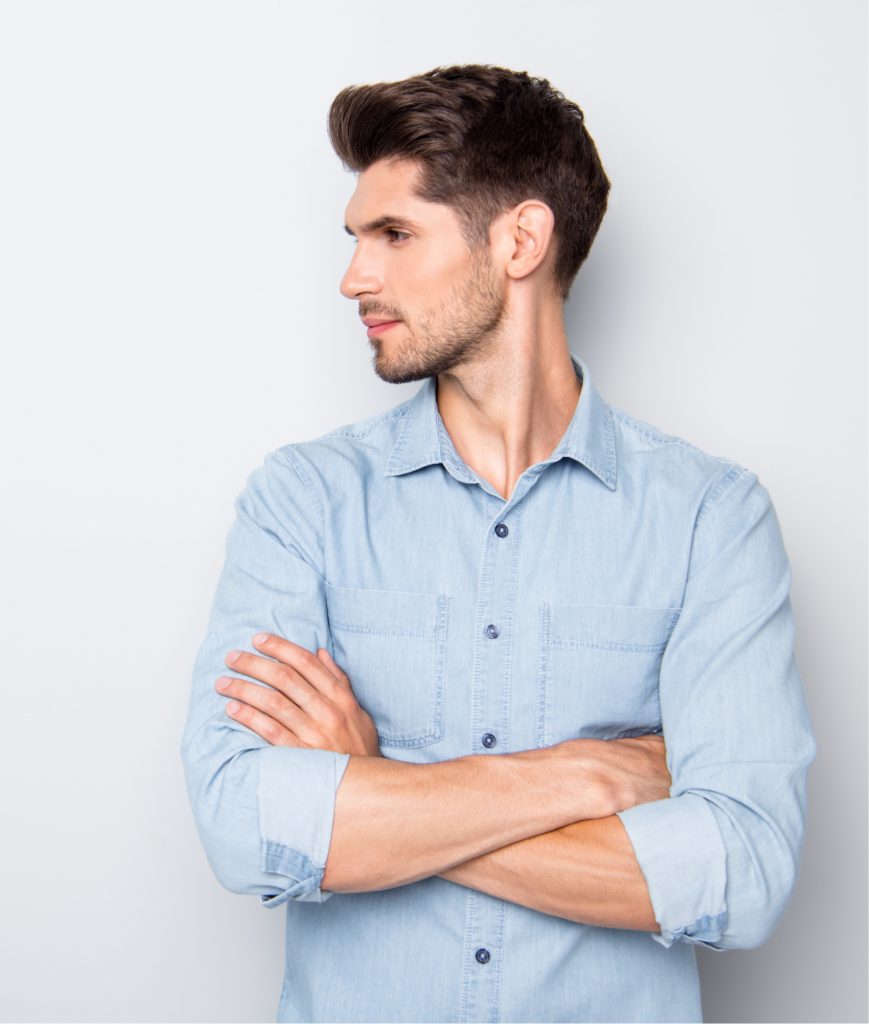 Man in a blue shirt looking sideways