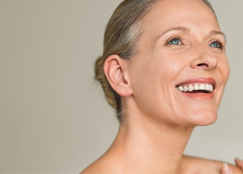 Happy older woman after facelift surgery