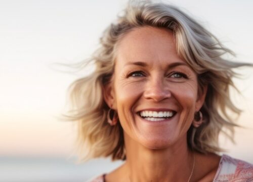 Photo of a happy middle-aged woman at the beach
