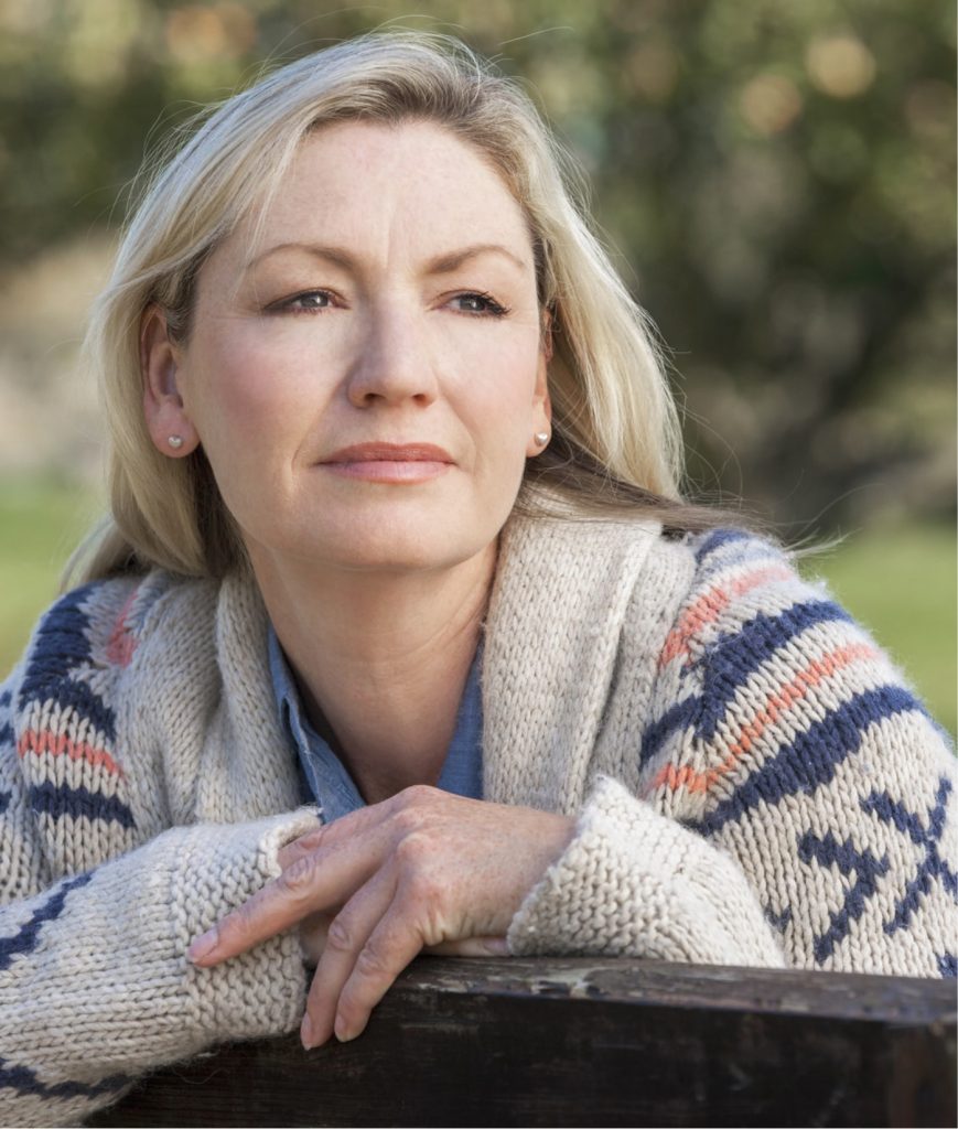 Woman in a sweater outdoors