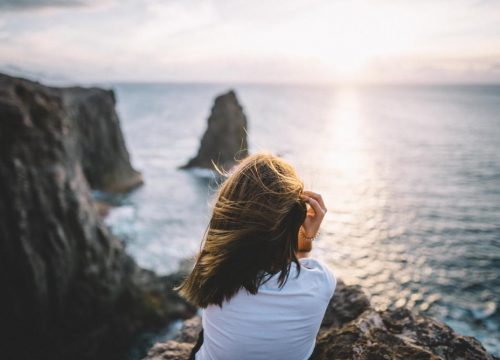 Woman looking at the ocean