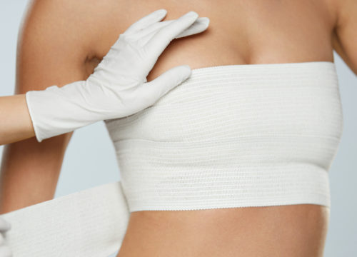 Woman's breast and chest being wrapped with gauze