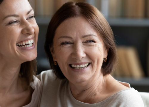 Two women laughing together