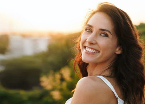 Smiling woman with great skin after Potenza™ treatments