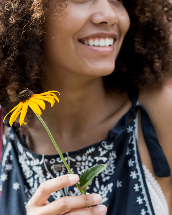 Woman holding a flower