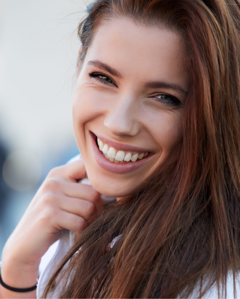 Woman with brown hair smiling