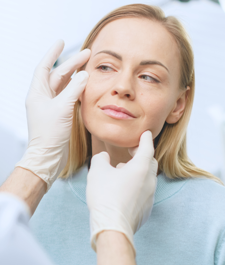 Woman getting her face looked at by a plastic surgeon