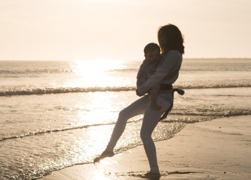 Mom with her baby at the beach