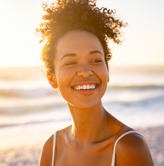 Smiling woman at the beach