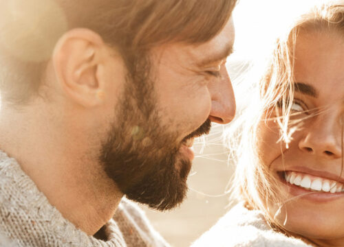 Happy couple with great skin at the beach