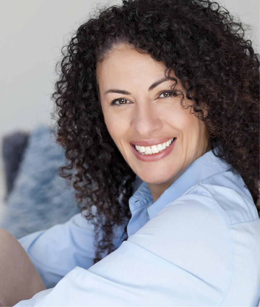 Woman with dark curly hair